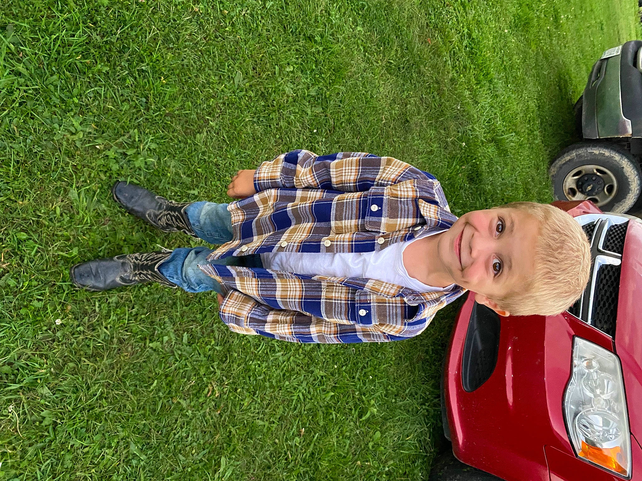 Jonathan joined the competition — help win amazing prizes! automotive_tire, car, family_car, fun, grass, hat, joy, leisure, motor_vehicle, pattern, people_in_nature, person, plaid, plant, recreation, tartan, tire, toddler, tree, vehicle