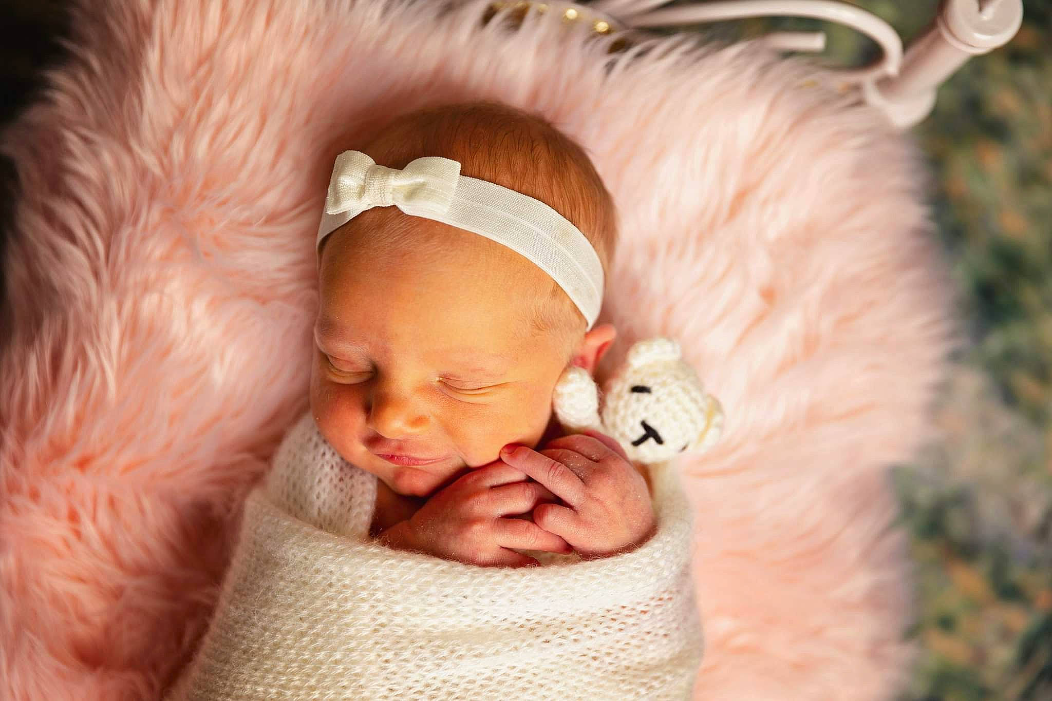 Lilith is registered to the contest to win money with this photo: baby, baby_products, baby_sleeping, baby_toddler_clothing, bedtime, cheek, child, christmas, comfort, ear, eye, fur, happy, headgear, linens, nap, nose, person, pink, toddler
