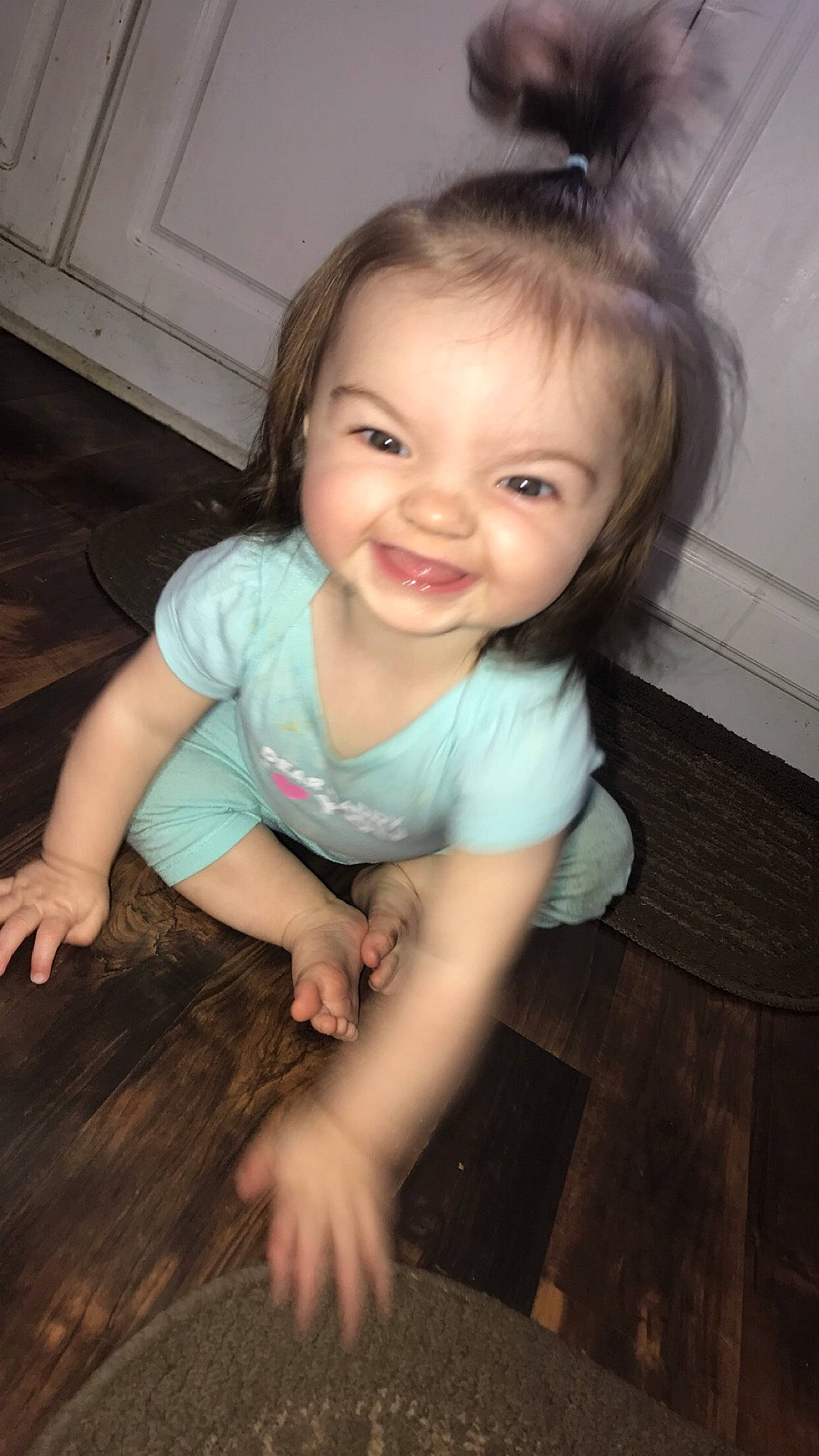 Braelynn is registered to the contest to win money with this photo: cheek, child, chin, eye, face, facial_expression, floor, flooring, fun, head, iris, joy, leg, mouth, nose, person, sitting, skin, smile, standing
