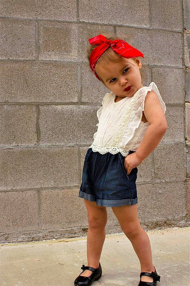 Adalee is registered to the contest to win money with this photo: cap, child, child_model, clothing, dress, fashion, fashion_accessory, footwear, headgear, leg, pattern, person, red, shoe, shorts, sleeve, street_fashion, t_shirt, waist