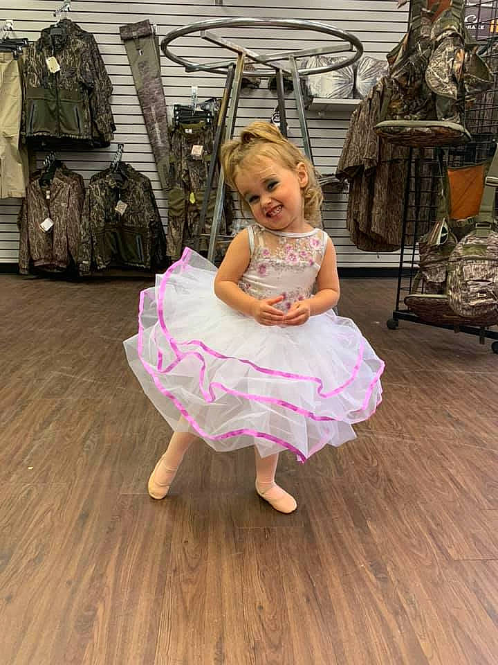 Adalee is registered to the contest to win money with this photo: child, child_model, costume, dance, dress, floor, flooring, footwear, hardwood, joy, laminate_flooring, person, pink, room, shoe, shoulder, sitting, toddler, wood, wood_flooring