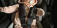 Novah is registered to the contest to win money with this photo: baby, car_seat, pacifier, sleeping, knitted_clothing, hoodie, leopard_print, mittens, shoes, white_shoes, infant, child, seatbelt, safety, cute, adorable, comfort, nap, indoors, child_safety