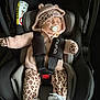 baby, car_seat, pacifier, sleeping, knitted_clothing, hoodie, leopard_print, mittens, shoes, white_shoes, infant, child, seatbelt, safety, cute, adorable, comfort, nap, indoors, child_safety