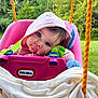 baby, child, swing, pink_hoodie, blue_eyes, little_tikes, blanket, plush_toy, orange_rope, outdoor, greenery, grass, tree, cute, infant, seat, play, portrait, childhood, nature