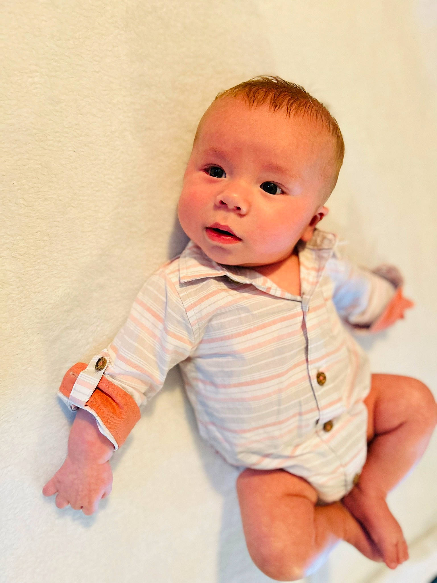 Haze is registered to the contest to win money with this photo: abdomen, baby, baby_toddler_clothing, cheek, collar, comfort, dress_shirt, elbow, eye, gesture, happy, human_body, pattern, peach, person, sitting, sleeve, stomach, t_shirt, thumb