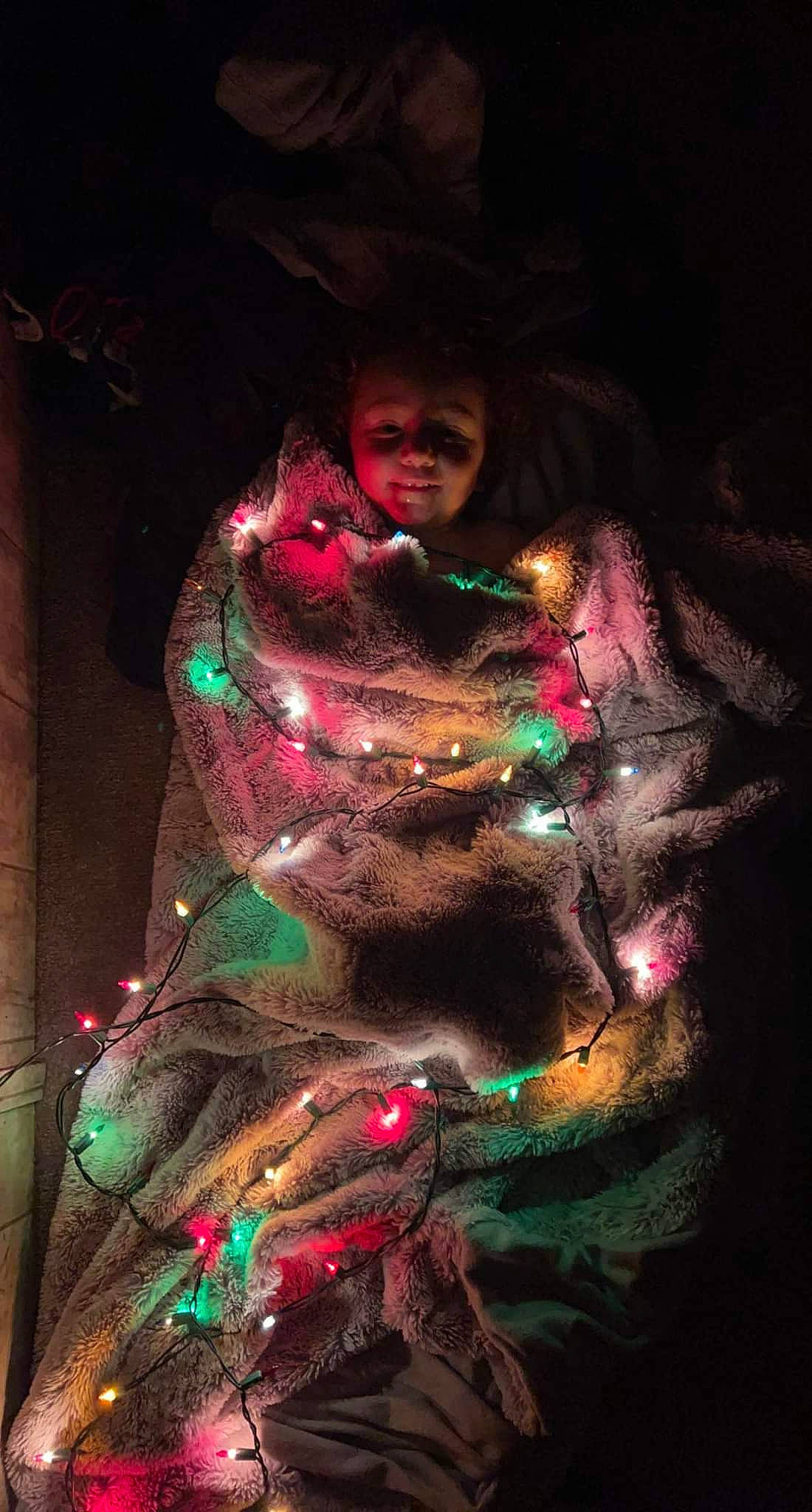 Julia is registered to the contest to win money with this photo: art, christmas, christmas_decoration, christmas_lights, darkness, entertainment, event, fictional_character, fun, holiday, magenta, midnight, night, performance_art, person, pink, plant, purple, tradition, tree