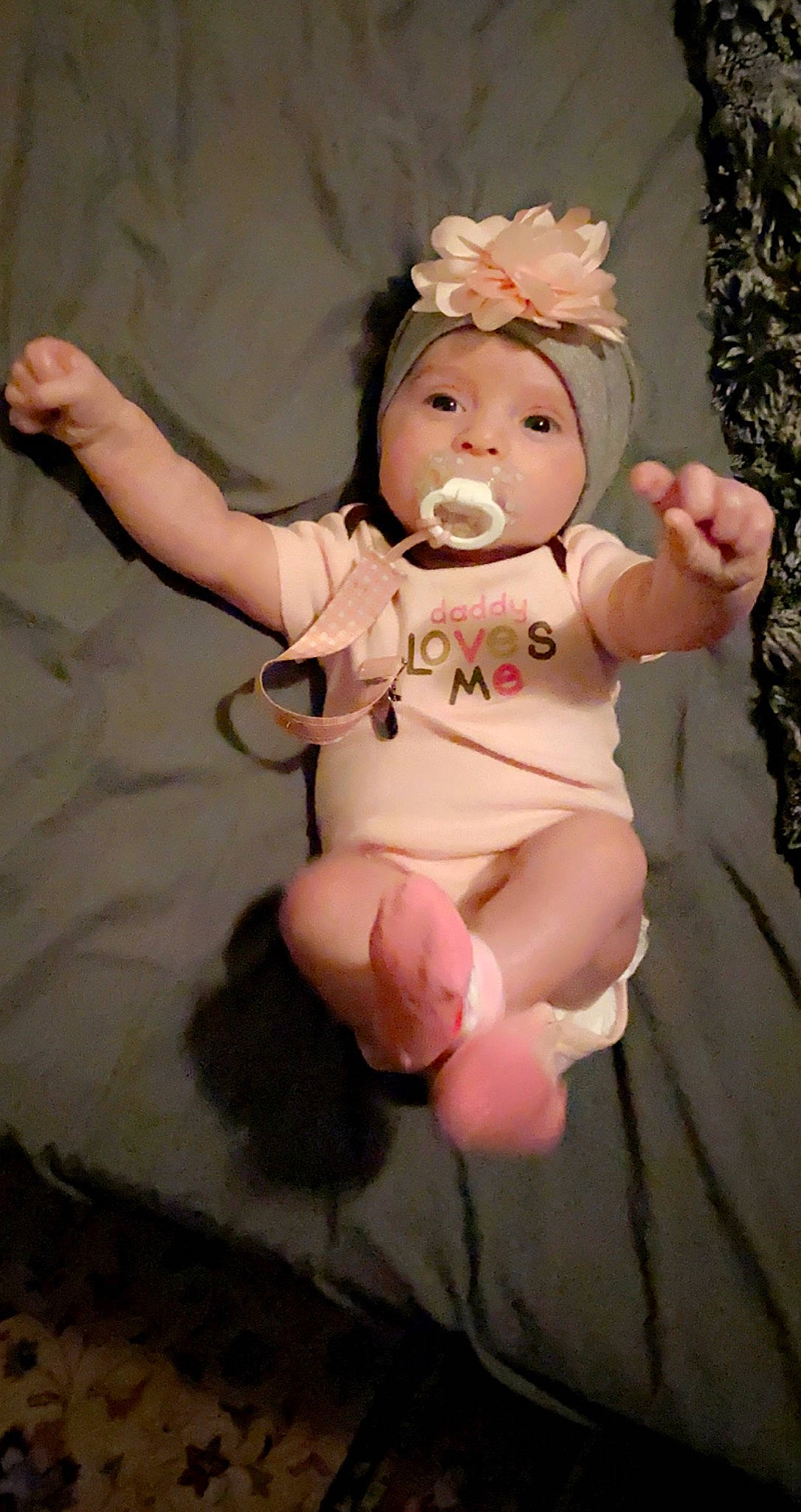 Scarlett is registered to the contest to win money with this photo: abdomen, baby, baby_toddler_clothing, cheek, child, fashion_accessory, fawn, finger, foot, headband, headpiece, headwear, human_leg, nail, peach, person, pink, sitting, teddy_bear, thumb