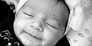 Valencia joined the competition — help win amazing prizes! baby, infant, headband, bow, black_and_white, sleeping, face, cute, clothing, pattern, blanket, portrait, closeup, child, smile, resting, young, happy, soft_lighting, indoors