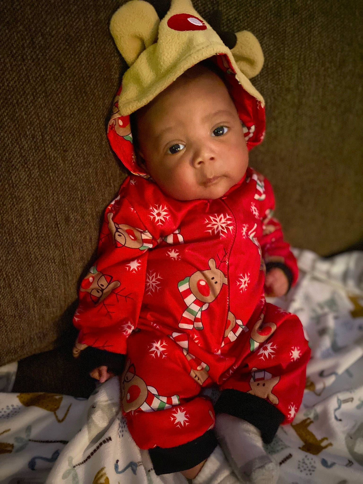 Devante is registered to the contest to win money with this photo: baby, baby_toddler_clothing, cap, cheek, collar, costume_hat, doll, dress, face, fashion_accessory, hat, head, human_body, lip, one_piece_garment, pattern, person, skin, sleeve, textile