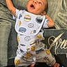 Willow is registered to the contest to win money with this photo: baby, infant, smiling, lying_down, blanket, clothing, cute, happy, one_month, celebration, child, face, portrait, young, babygirl, newborn, indoors, person, babysuit, playful