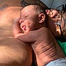 Willow is registered to the contest to win money with this photo: baby, newborn, diaper, skin, tongue, adult, glasses, tattoo, resting, cuddling, sunlight, bed, sleeping, closeup, family, intimate, love, warmth, relaxation, portrait