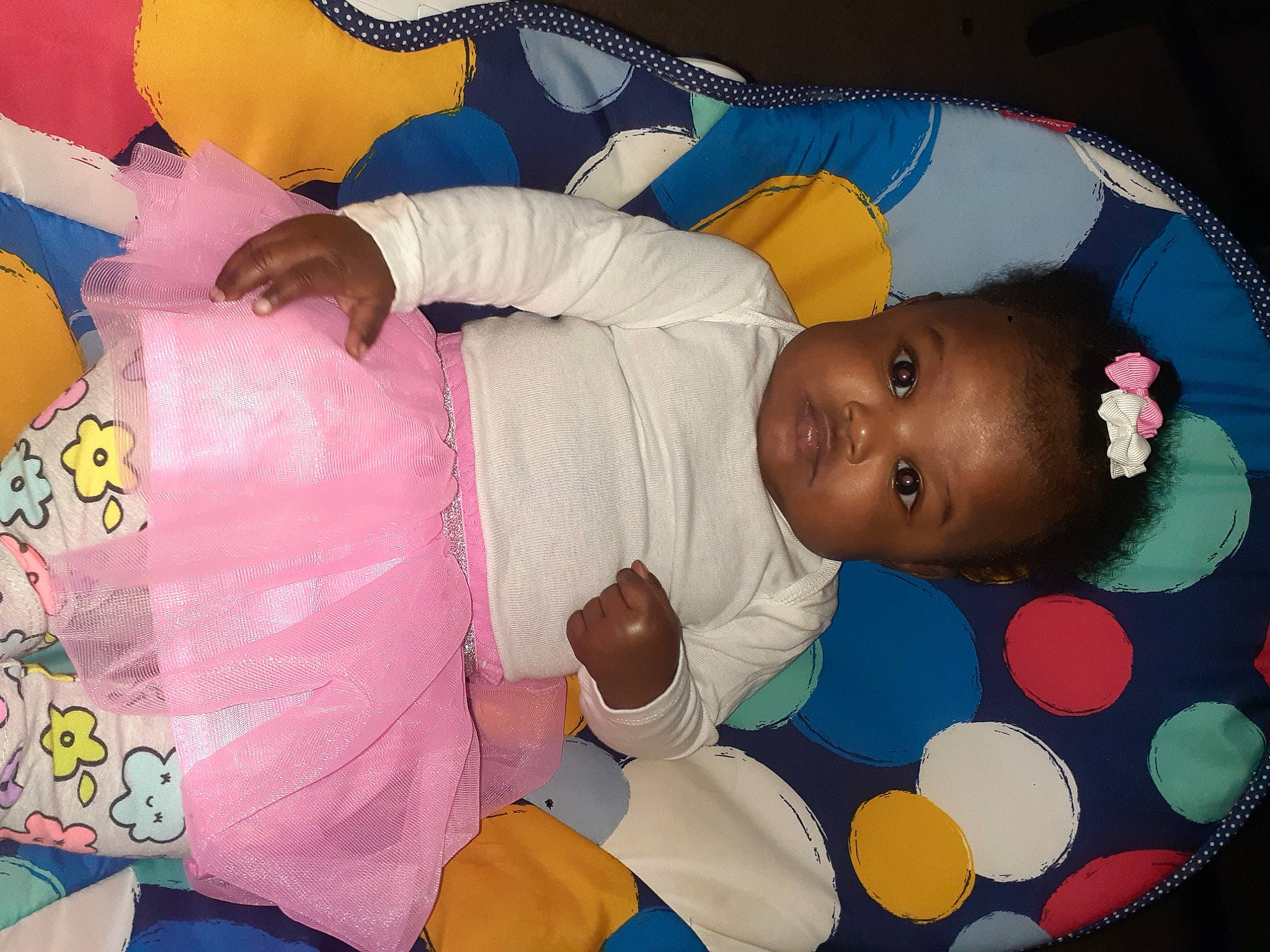 Elaina is registered to the contest to win money with this photo: baby, baby_products, baby_toddler_clothing, baby_toys, beauty, bedtime, cheek, child, comfort, facial_expression, fun, happy, linens, pattern, person, pink, play, product, room, skin