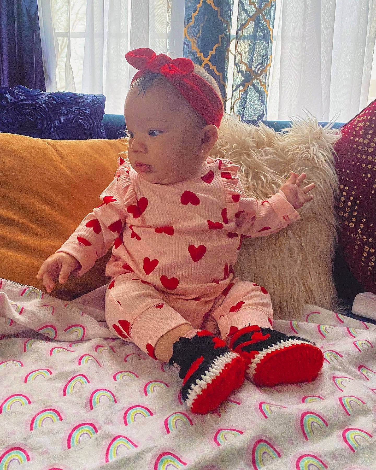 Elianna joined the competition — help win amazing prizes! baby, baby_toddler_clothing, carmine, child, comfort, dress, facial_expression, floor, flooring, fun, hat, linens, mammal, pattern, person, pink, room, skin, sleeve, textile