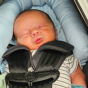 Kaison joined the competition — help win amazing prizes! newborn, baby, sleeping, car_seat, safety_harness, blue_cushion, striped_clothing, mitten, infant, child, peaceful, closeup, head, face, cute, resting, indoors, soft_lighting, tiny, portrait