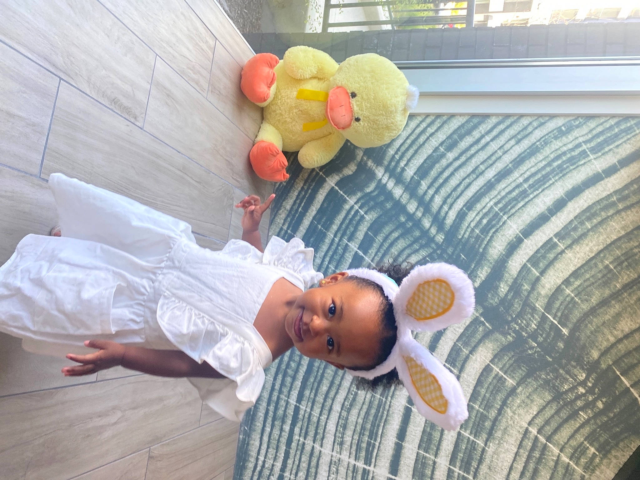 Sloane is registered to the contest to win money with this photo: baby, baby_products, baby_safety, bed, child, comfort, couch, flooring, fun, hat, joy, leisure, linens, nap, person, play, room, sitting, sun_hat, toddler
