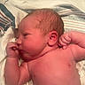 Carter joined the competition — help win amazing prizes! newborn, baby, infant, sleeping, face, portrait, hospital_bedding, blanket, striped_blanket, lying_down, fists, arms, head, skin, ear, nose, eyes, indoor, close_up, photography