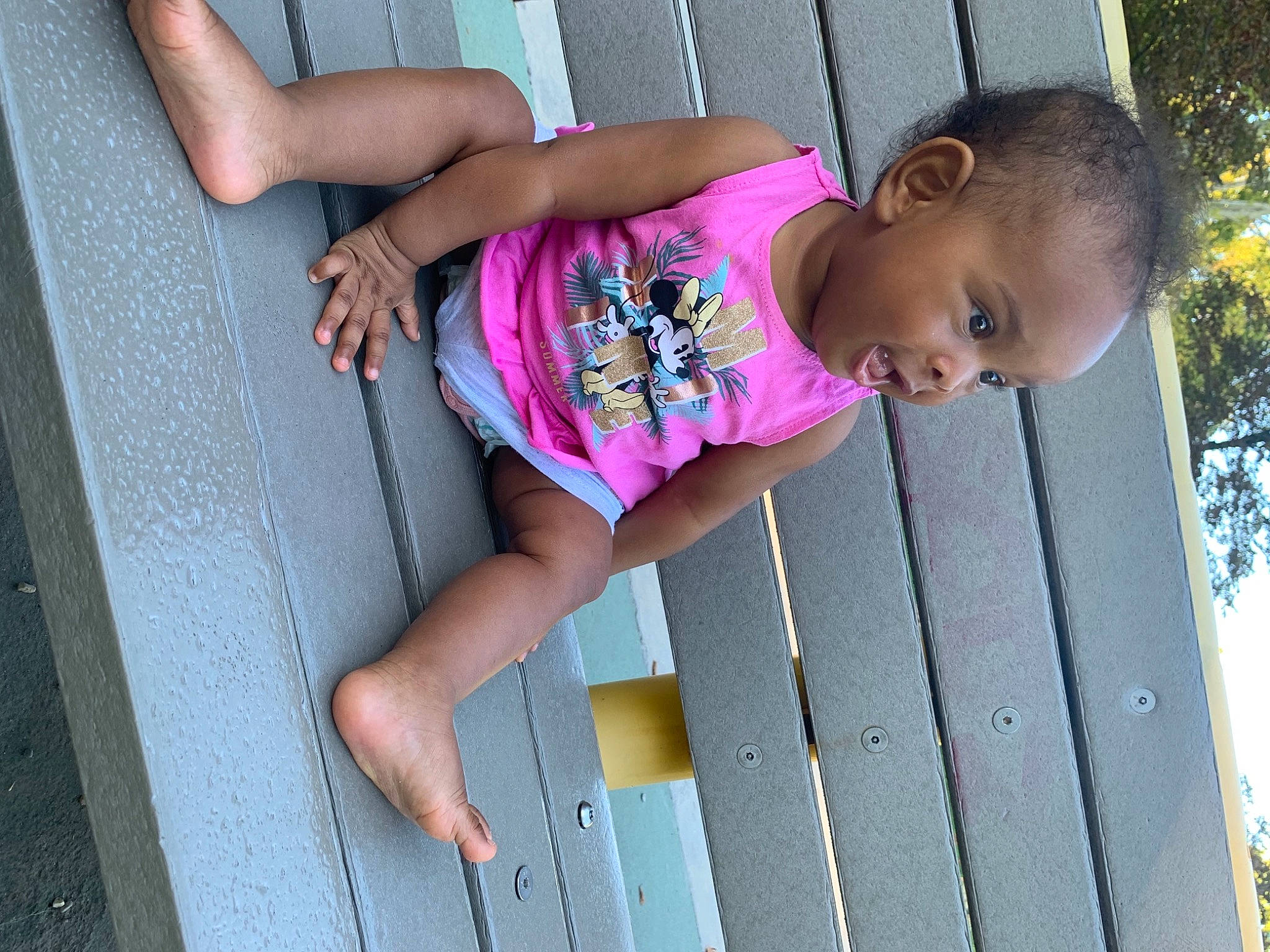 Julia participe au concours pour gagner de l'argent avec cette photo : baby_toddler_clothing, child, foot, grass, happy, human_leg, knee, leg, leisure, magenta, person, pink, plant, skin, smile, t_shirt, thigh, toddler, tree, waist