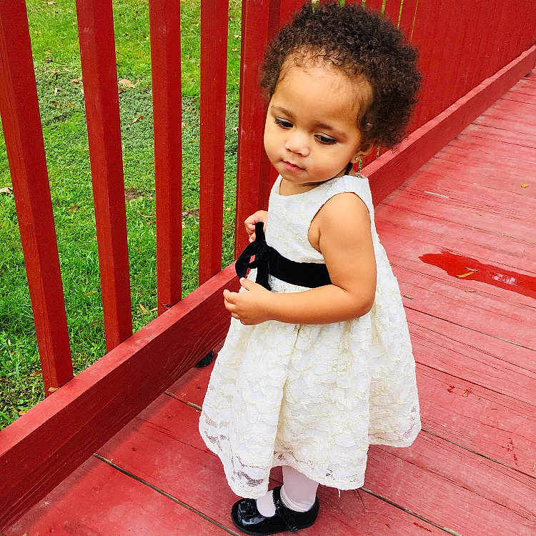 Zarianna joined the competition — help win amazing prizes! child, dress, facial_expression, flooring, fun, girl, happiness, infant, pattern, person, pink, product, red, sitting, skin, smile, standing, textile, toddler