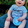 baby, child, blue_eyes, smiling, striped_shirt, outdoor, greenery, cushion, grass, cat, hand, feet, card, cute, happy, sitting, nature, portrait, infant, summer