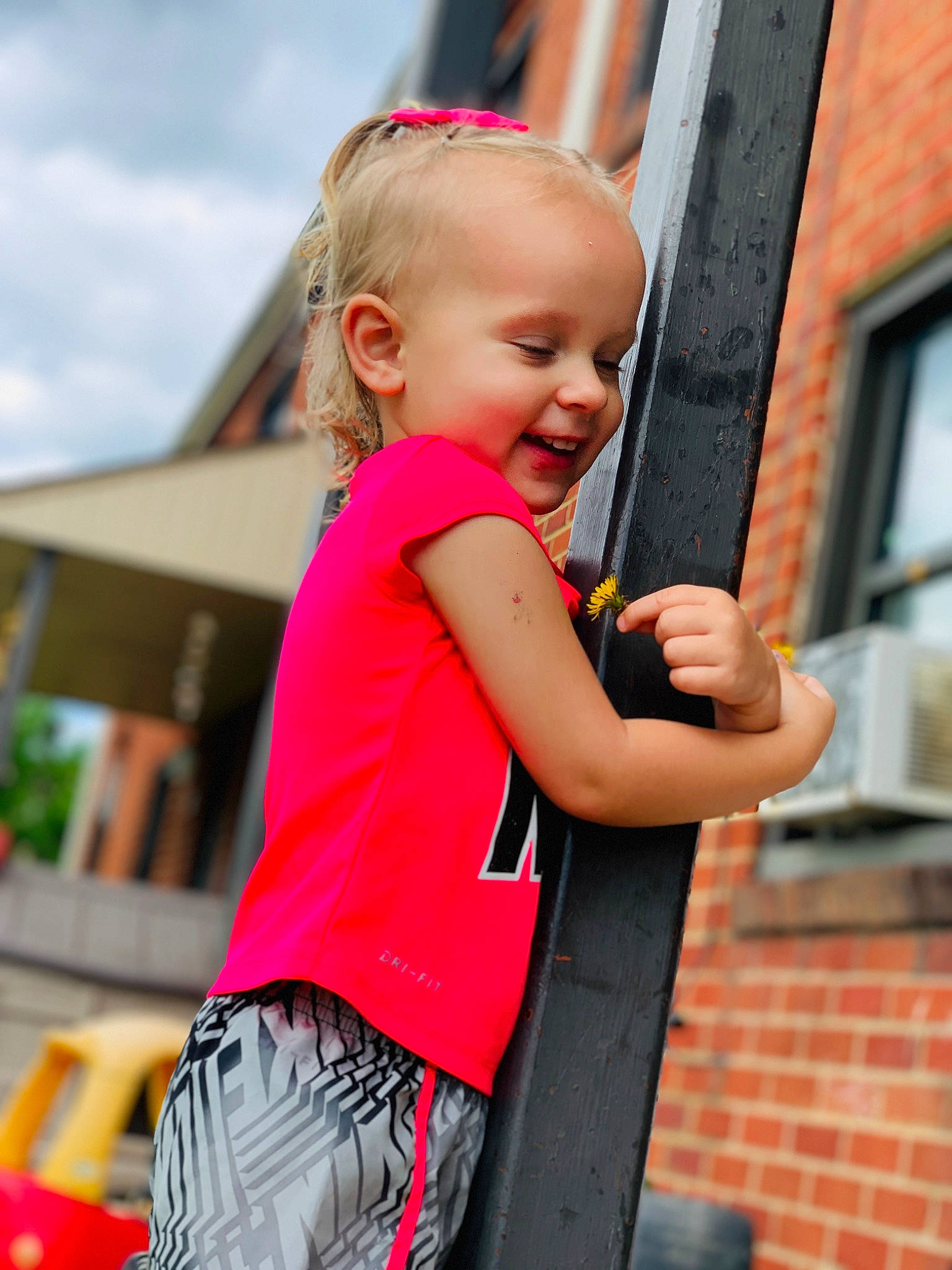 Kimber joined the competition — help win amazing prizes! baby, blond, brick, child, event, face, fun, happy, human_settlement, leisure, magenta, person, pink, recreation, red, sky, sleeve, smile, t_shirt, toddler