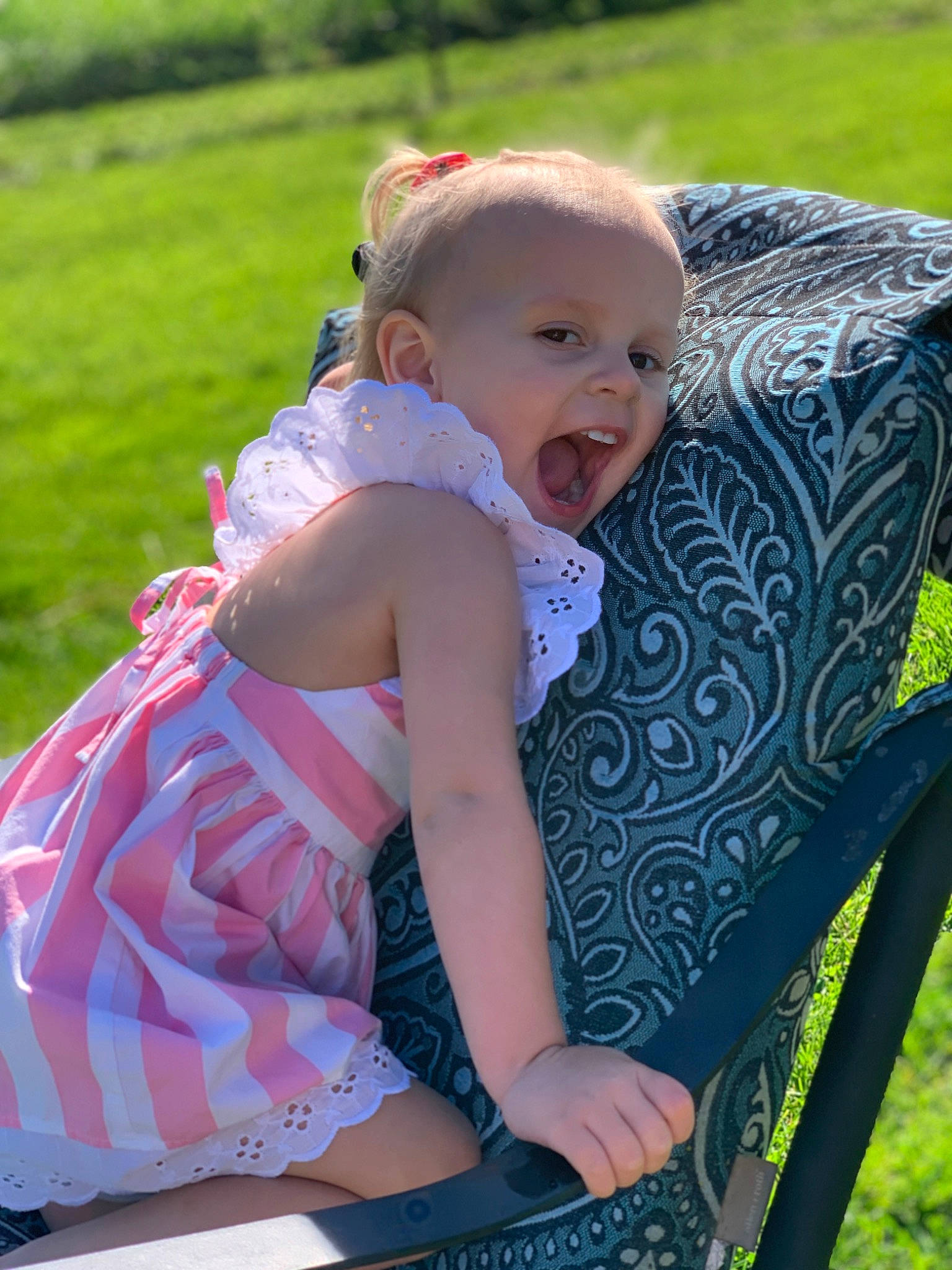 Kimber joined the competition — help win amazing prizes! baby, baby_toddler_clothing, beauty, child, fun, grass, grass_family, happy, lap, lawn, leisure, people, people_in_nature, person, pink, plant, product, recreation, sitting, summer