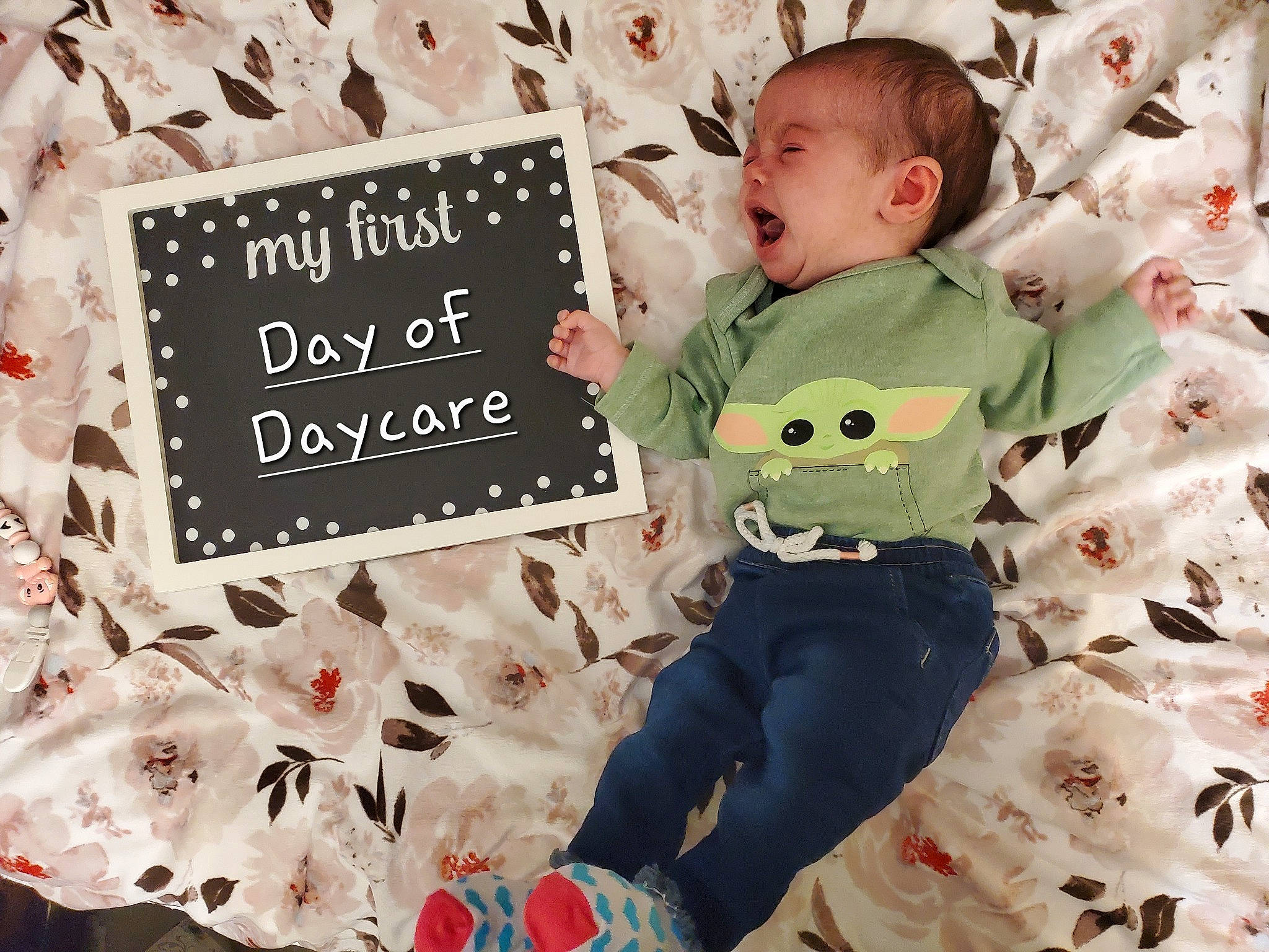 Alexandria is registered to the contest to win money with this photo: baby, baby_toddler_clothing, carmine, child, comfort, event, font, happy, head, leaf, linens, pattern, person, pink, product, rectangle, room, sitting, sleeve, textile