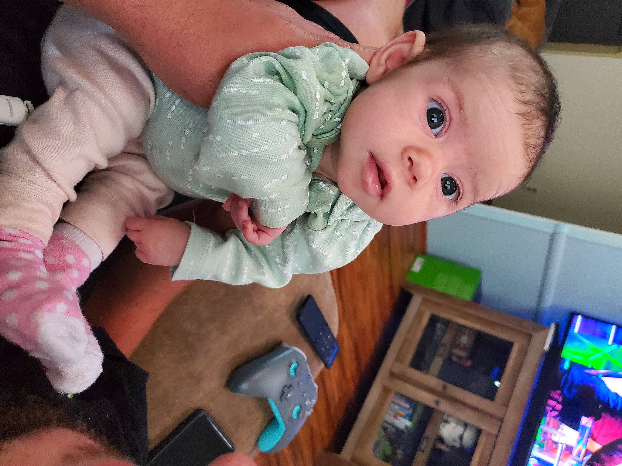 Alexandria is registered to the contest to win money with this photo: baby, baby_products, baby_toddler_clothing, cheek, chest, child, finger, fun, hand, happy, mouth, nail, nose, person, play, room, sitting, skin, thumb, toddler