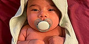 Jerzain Eden joined the competition — help win amazing prizes! baby, blanket, bodypart, bonnet, clothing, face, finger, hand, hat, head, hood, hoodie, knitwear, newborn, person, photography, portrait, sweater, sweatshirt, towel