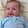 baby, smiling, blue_clothing, infant, face, happy, leather_couch, portrait, cute, child, sitting, indoor, buttoned_shirt, young_child, skin, head, eyes, mouth, expression, cozy