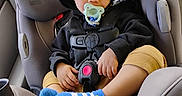 Octavius is registered to the contest to win money with this photo: baby, car_interior, car_seat, child, clothing, comfort, cute, hoodie, infant, pacifier, peaceful, rest, safety, seat, seatbelt, sleeping, socks, toddler, travel, young_child