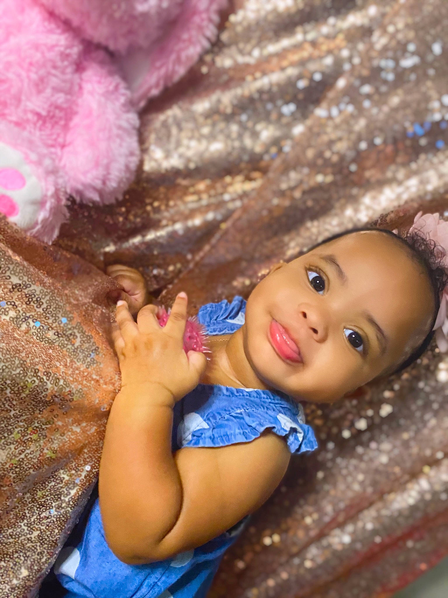 Brooke is registered to the contest to win money with this photo: arm, baby, black_hair, close_up, doll, eyelash, fawn, finger, hand, happy, human_body, nail, nose, organ, person, pink, skin, textile, toy, tree