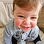 Tommy participe au concours pour gagner de l'argent avec cette photo : baby, child, closeup, clothing, couch, cozy, cute, face, hair, hands, happy, indoor, person, portrait, rosy_cheeks, sitting, smiling, sweater, toddler, white_shoes