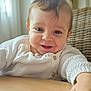 Tommy a rejoint le concours — aidez-le/la à gagner de superbes lots ! baby, child, closeup, cute, expression, face, hand, happy, indoor, infant, knitted_sweater, natural_light, person, portrait, skin, smiling, table, white_clothing, wicker_chair, young