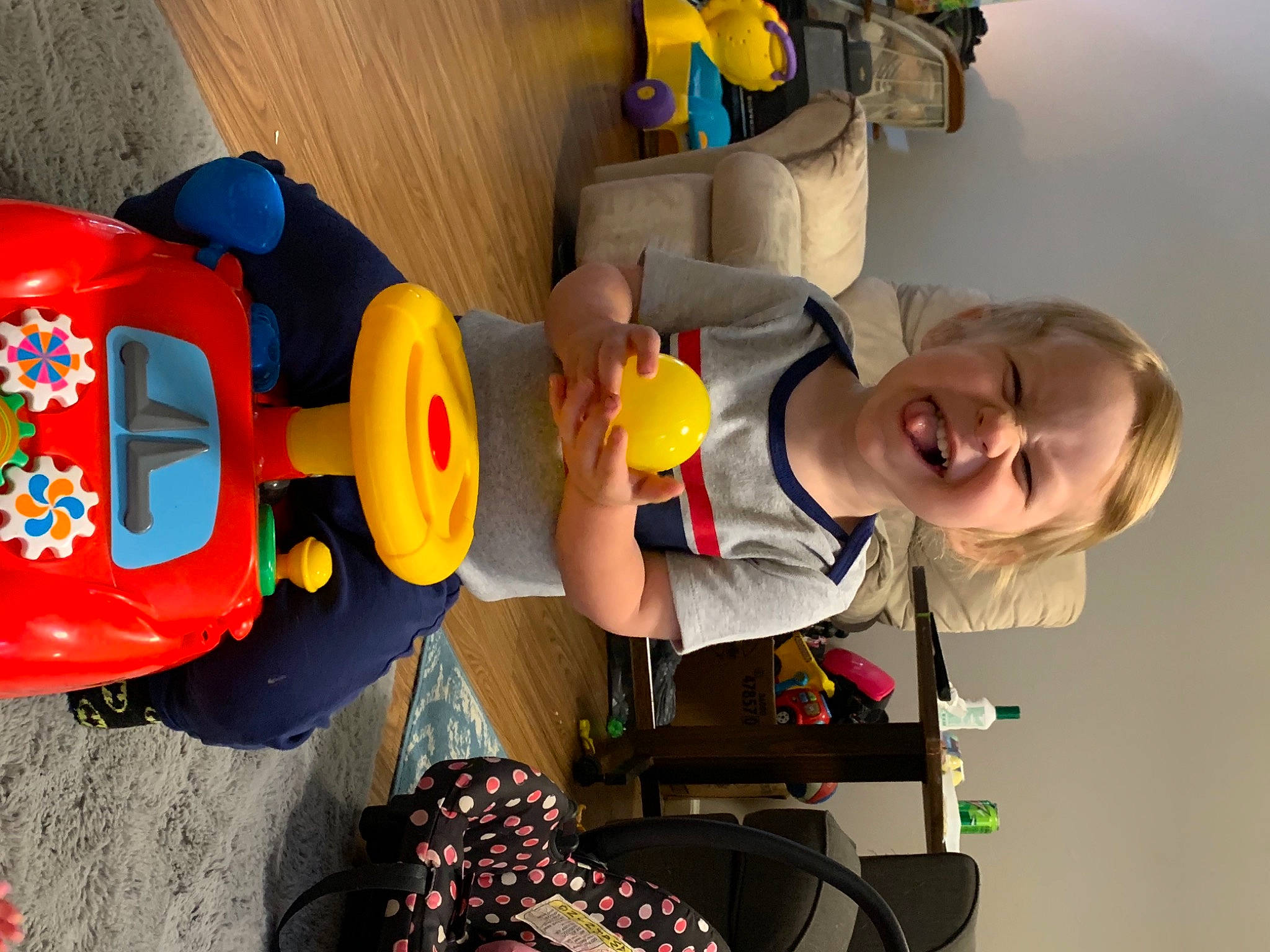 Klause is registered to the contest to win money with this photo: baby, baby_products, baby_toys, child, fictional_character, fun, lego, leisure, machine, people, person, personal_protective_equipment, play, recreation, room, smile, t_shirt, tire, toddler, toy