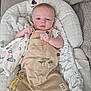 baby, infant, child, overalls, lion_king, blanket, baby_seat, cushion, soft_toys, clothing, cute, indoor, portrait, face, hands, expression, comfort, texture, sleepwear, star_pattern