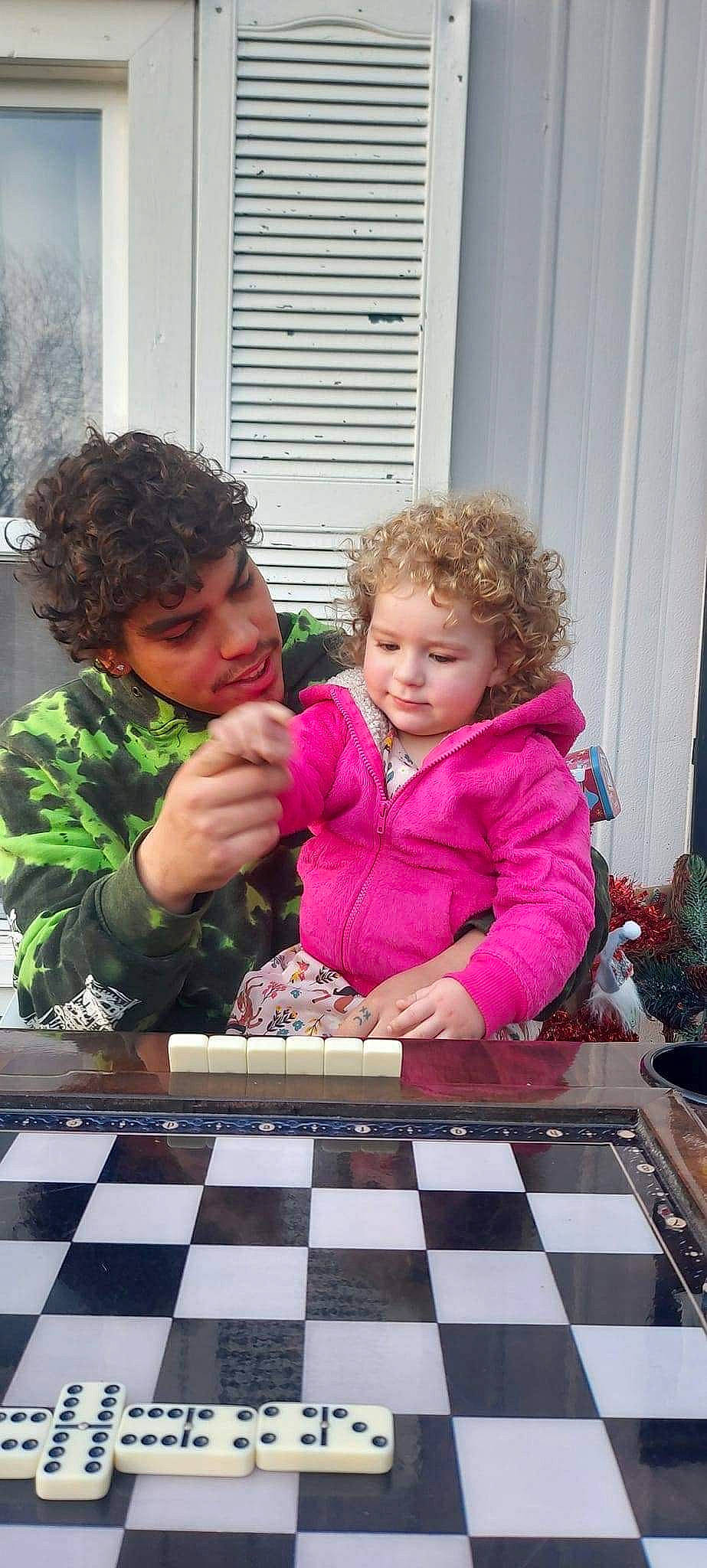 Azura is registered to the contest to win money with this photo: board_game, chair, chess, chessboard, child, competition_event, event, fun, games, indoor_games_and_sports, leisure, people, person, photograph, recreation, sharing, snapshot, table, thumb, toddler