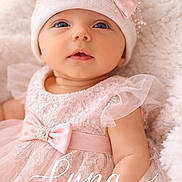 Lyna participe au concours pour gagner de l'argent avec cette photo : baby, infant, girl, pink_dress, lace, hat, bow, pearls, soft_blanket, portrait, cute, child, newborn, smiling, face, headwear, tulle, adorable, closeup, laying_down