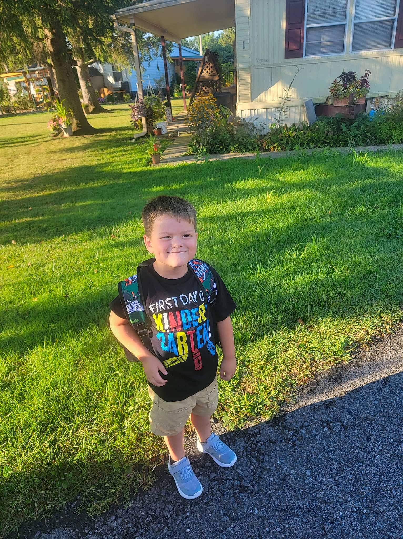 Jase is registered to the contest to win money with this photo: asphalt, electric_blue, fun, grass, grass_family, grassland, happy, joy, landscape, lawn, leisure, people_in_nature, person, plant, recreation, shorts, sidewalk, sleeve, t_shirt, tints_and_shades