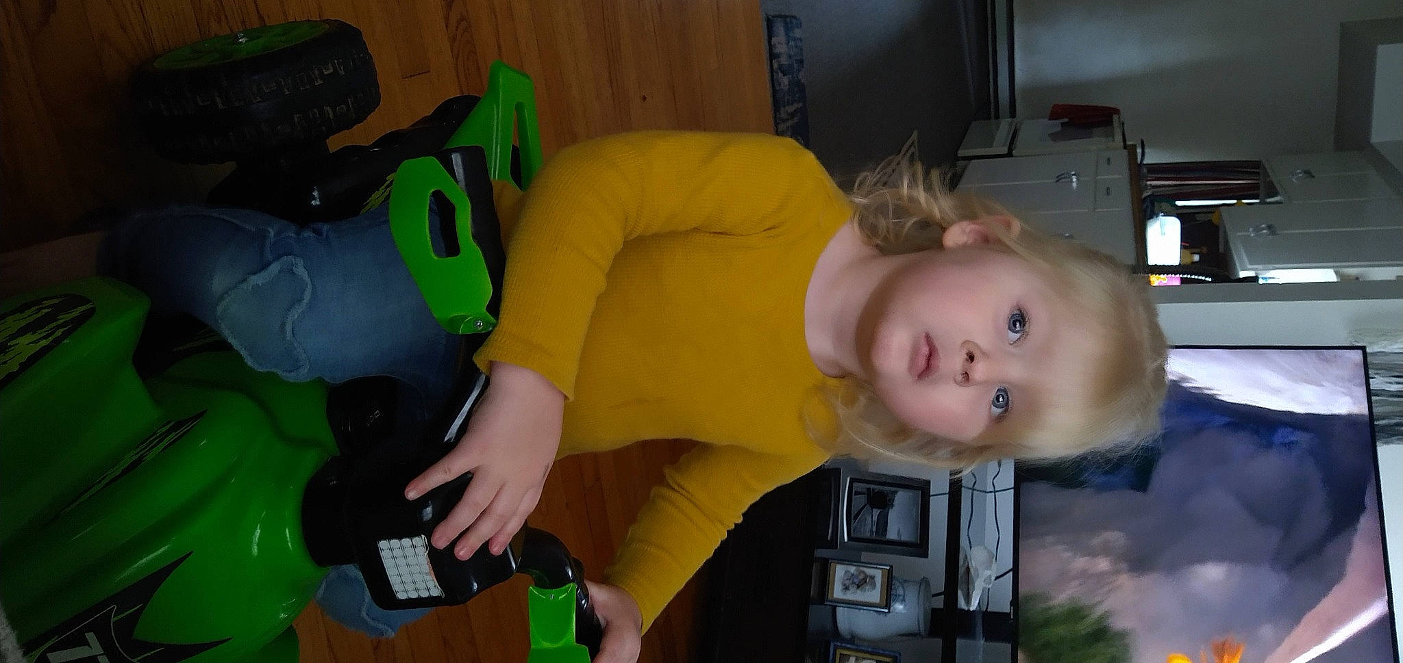 Riley is registered to the contest to win money with this photo: baby, bottle, child, comfort, couch, fun, green, lap, person, play, room, sitting, stuffed_toy, toddler, toy