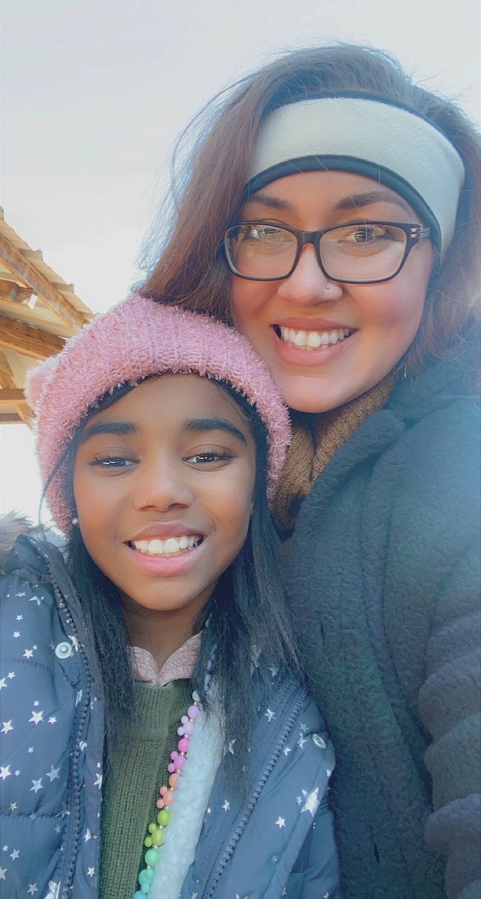 Laiyah is registered to the contest to win money with this photo: clothing, eye, eyebrow, face, facial_expression, forehead, glasses, hairstyle, happy, headwear, human, iris, joy, lip, mouth, organ, outerwear, person, plant, purple