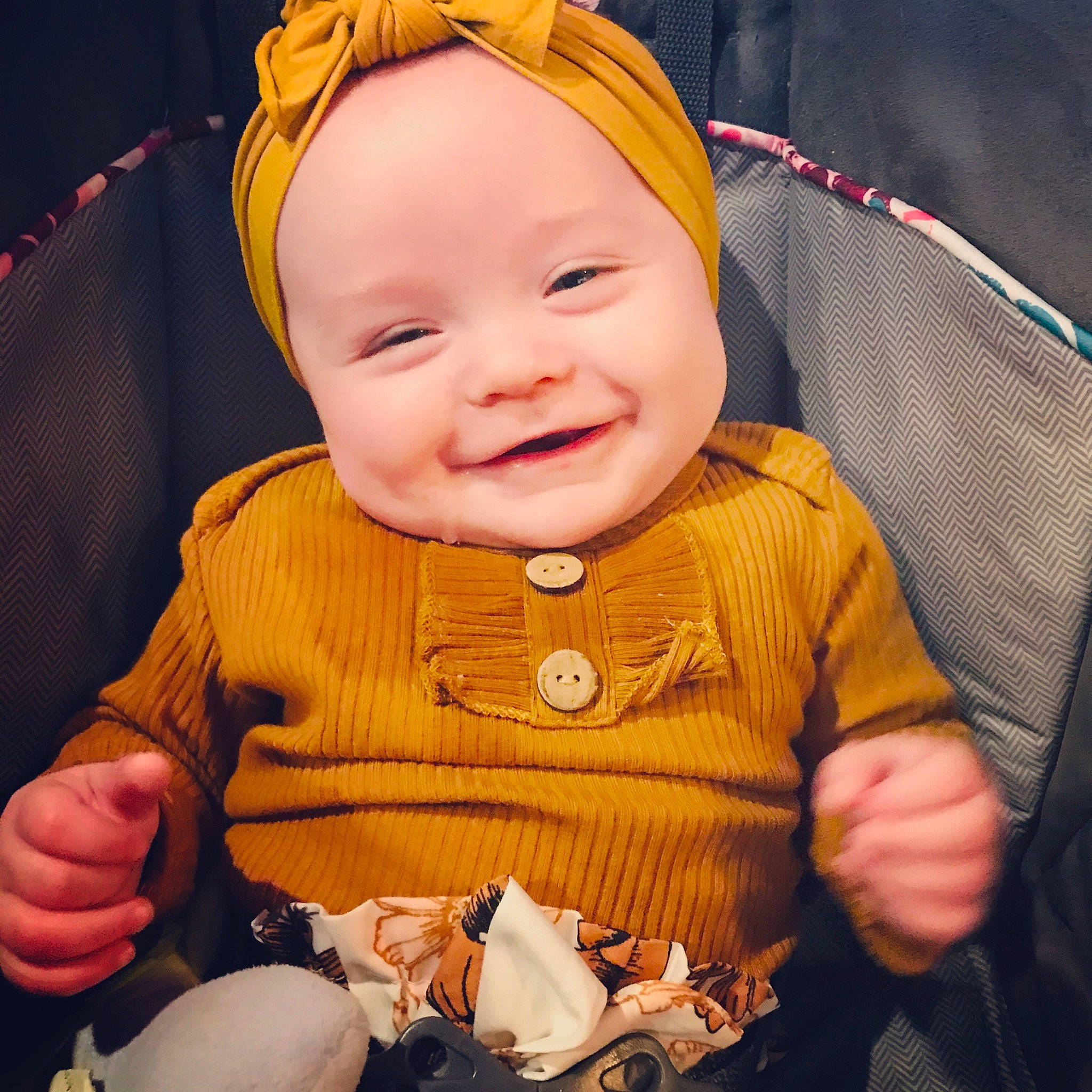 Paityn is registered to the contest to win money with this photo: baby, cheek, child, ear, eating, eye, face, facial_expression, finger, hair_accessory, happy, head, headband, iris, laugh, person, skin, smile, toddler, yellow