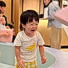 Jerome joined the competition — help win amazing prizes! adult, banana_print, blurred_background, casual_clothing, child, family, fun, happy, indoor, laughing, people, person, play_area, playful, short_hair, smile, toddler, white_tshirt, yellow_shorts, young_child