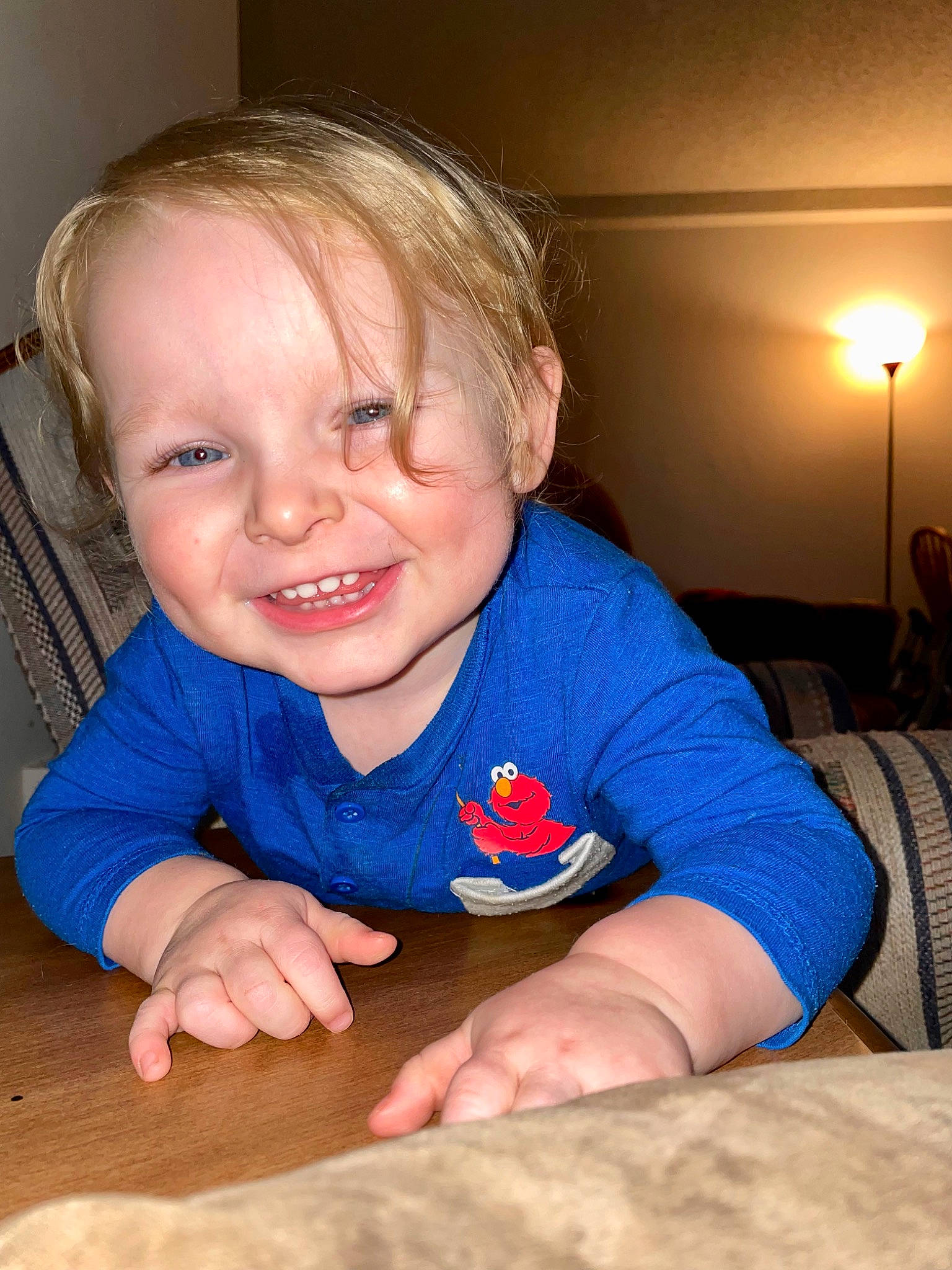 Jaxton is registered to the contest to win money with this photo: baby, baby_toddler_clothing, cheek, child, chin, comfort, eye, finger, floor, flooring, fun, happy, iris, joy, mouth, nose, person, skin, smile, street_light