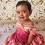 Calypso participe au concours pour gagner de l'argent avec cette photo : baby, child, smile, face, portrait, dress, knitted, pink, cream, crochet, sitting, hand, wallpaper, floral, pattern, indoors, cute, happy, person, infant