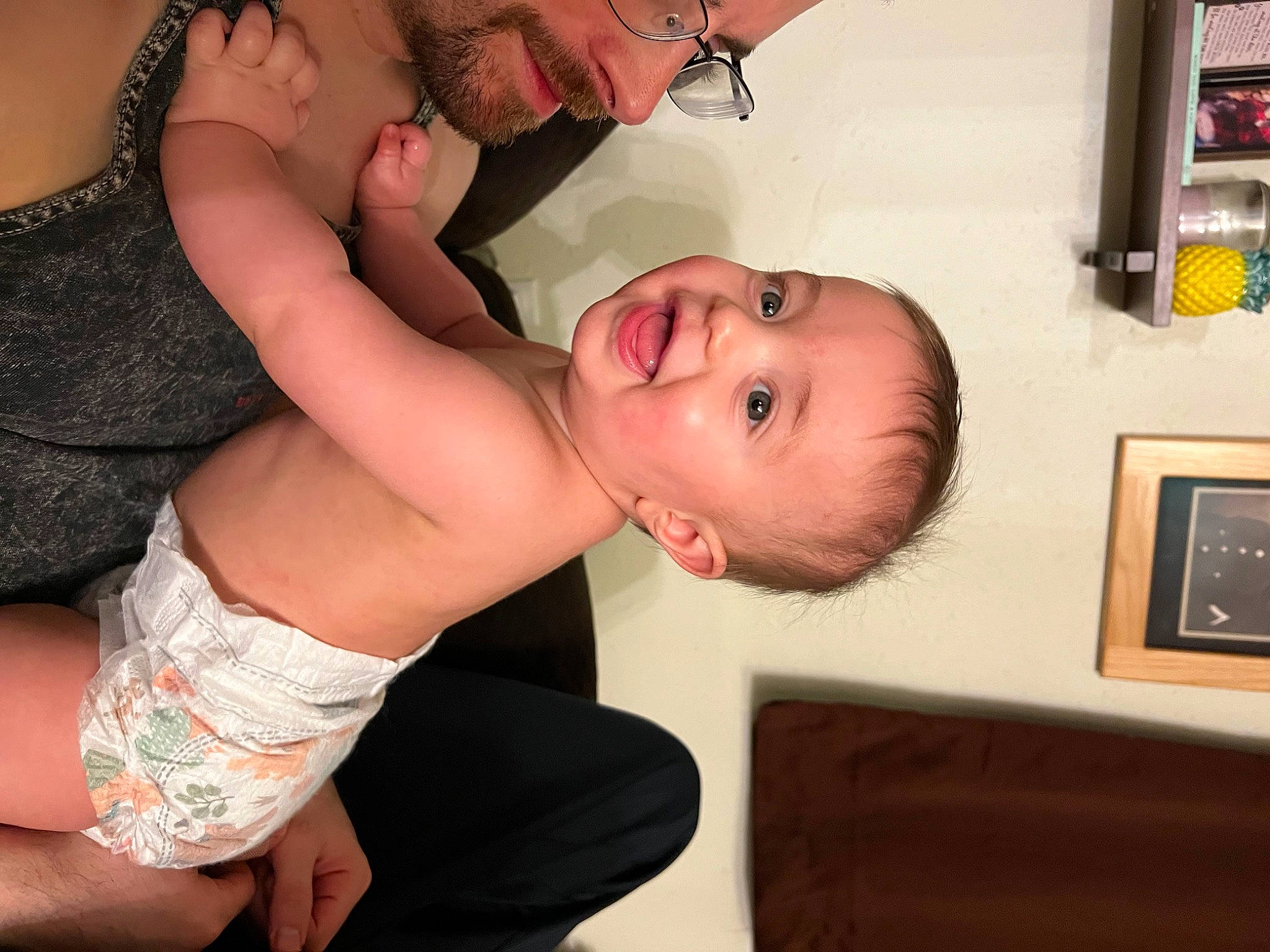 Jack is registered to the contest to win money with this photo: abdomen, baby, chest, dress, ear, elbow, eyelash, finger, gesture, happy, leg, muscle, nose, person, picture_frame, shelf, smile, stomach, thigh, toddler