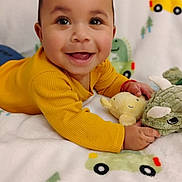 Sir' Hunter joined the competition — help win amazing prizes! baby, blanket, child, closeup, colorful, cozy, cute, face, hands, happy, indoor, infant, lying_down, playful, plush_toys, portrait, smiling, soft, toy, yellow_clothing