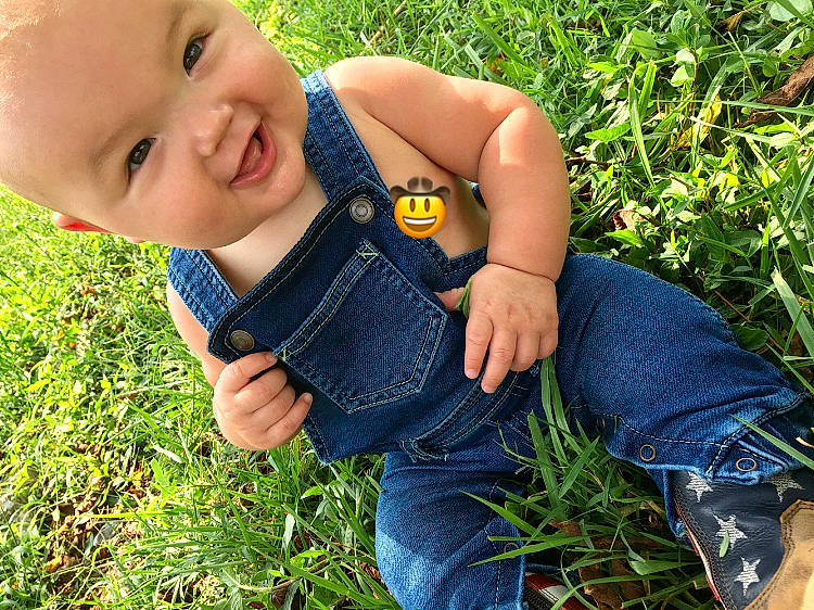 Carl is registered to the contest to win money with this photo: baby, child, denim, fashion_accessory, finger, grass, grass_family, hand, happy, jeans, lawn, meadow, person, photography, plant, toddler, yellow