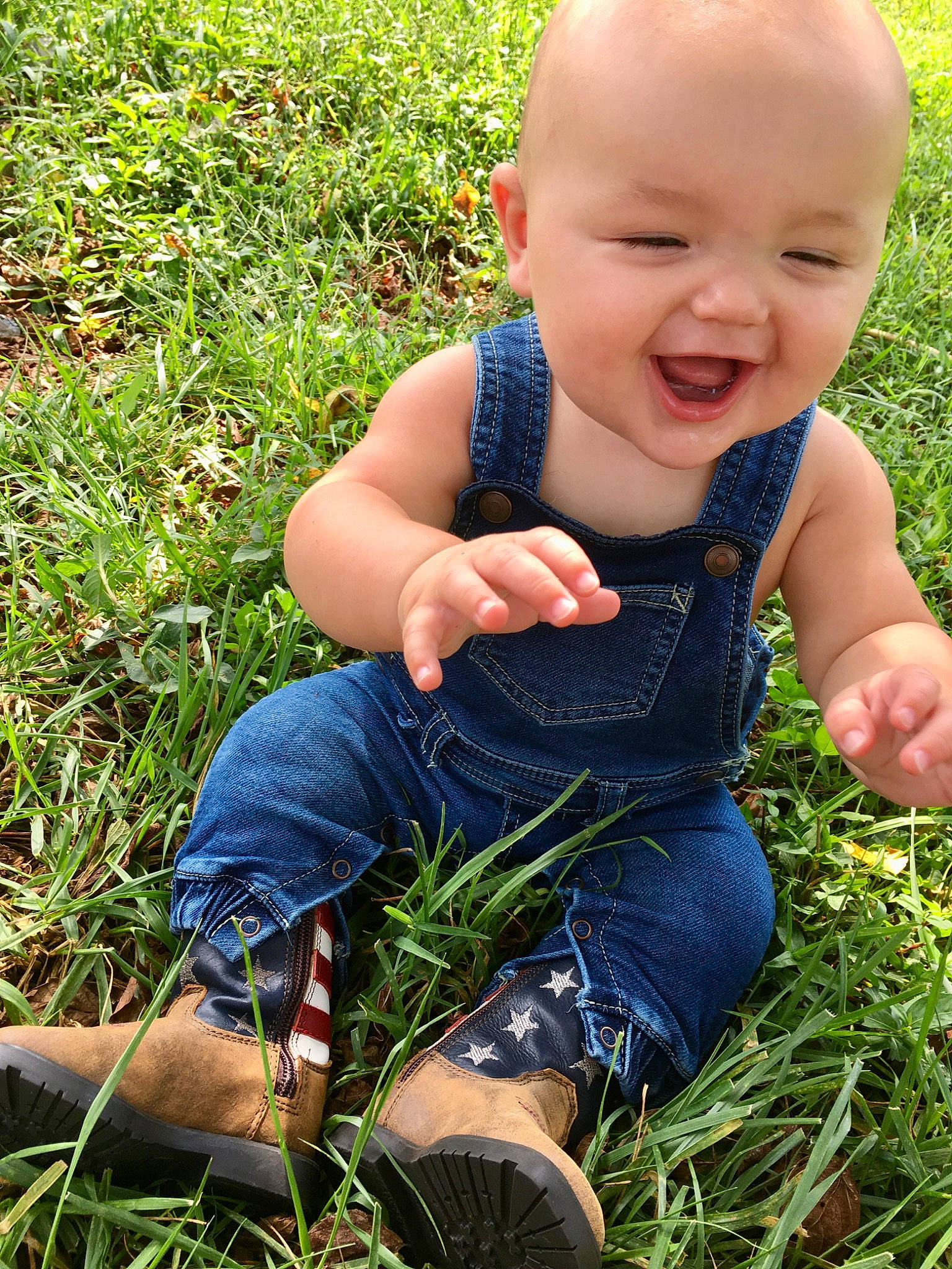 Carl joined the competition — help win amazing prizes! baby, child, finger, grass, grass_family, hand, happy, jeans, lawn, meadow, person, plant, play, sitting, skin, smile, thumb, toddler