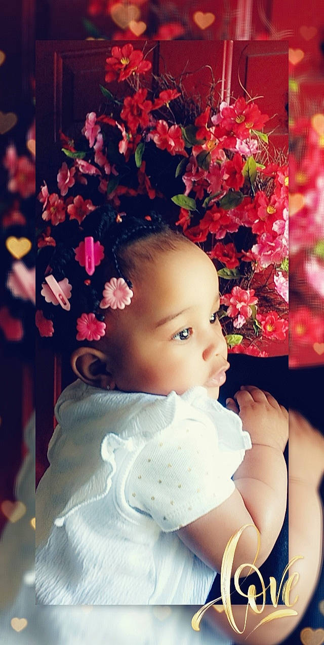 Ta'Mya is registered to the contest to win money with this photo: artificial_flower, baby, baby_toddler_clothing, beauty, child, cut_flowers, fashion_accessory, flash_photography, flower, flower_arranging, flowering_plant, hair_accessory, happy, lip, magenta, person, petal, pink, textile, toddler