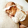 baby, newborn, sleeping, headband, lace, pillow, soft, cute, infant, resting, peaceful, closeup, child, adorable, cozy, fabric, texture, portrait, warm, indoor